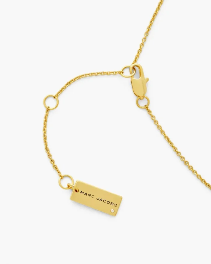 Halsband med knapp-hänge Halsband med knapp-hänge