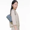 Quiltad mini-axelväska i denim